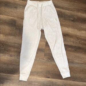 ALO Yoga Cream Track Pants with Tapered Fit